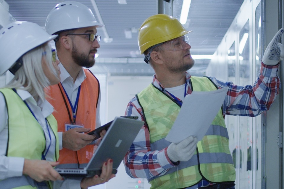 engineers examining equipment