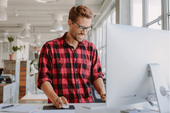 man working on a standing desk