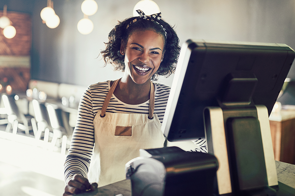 cafe owner at cash register